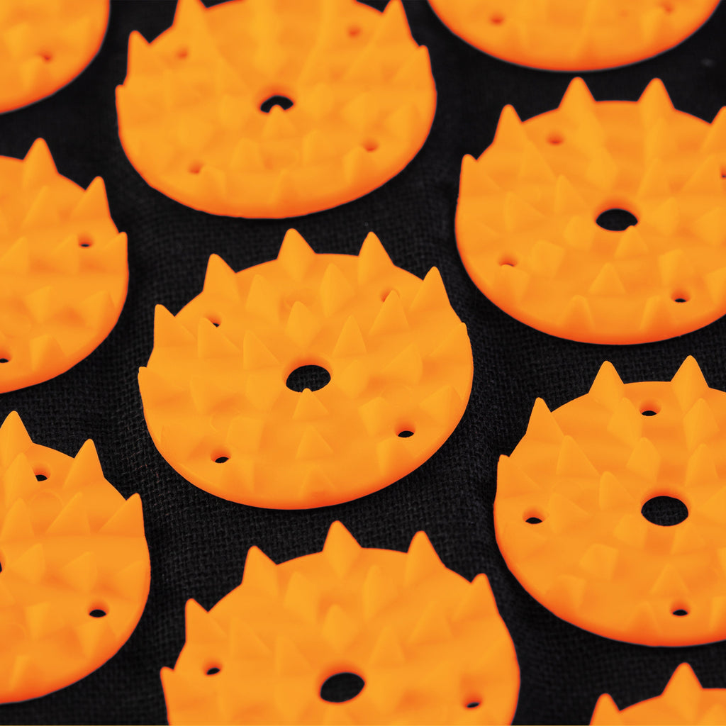 Pattern of orange fire-shaped crackers on a black background
