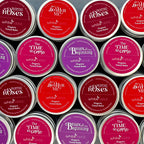 Collection of tins with various labels arranged in a pattern
