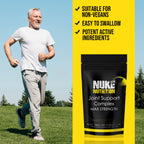 Man running outdoors with Nuke Nutrition supplement packaging on a yellow background