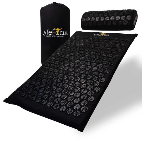 Black acupressure mat with roller and carrying bag on a white background, featuring Lyfe Focus branding.