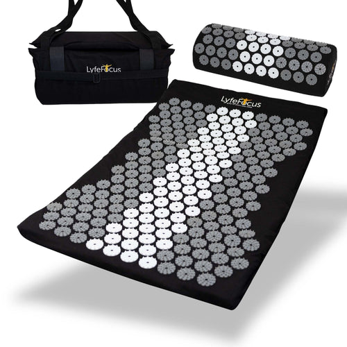 Acupressure mat and pillow set with carrying bag on a white background, branded 'Lyfe Focus'.