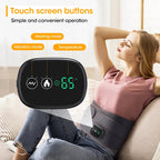 Woman using a heating pad with a digital display on a couch, featuring touch screen buttons for various modes.