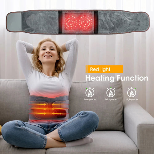 Woman using a heating pad with red light display on a couch, indicating heating function.