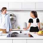 Woman wearing a back brace in a kitchen with a man.