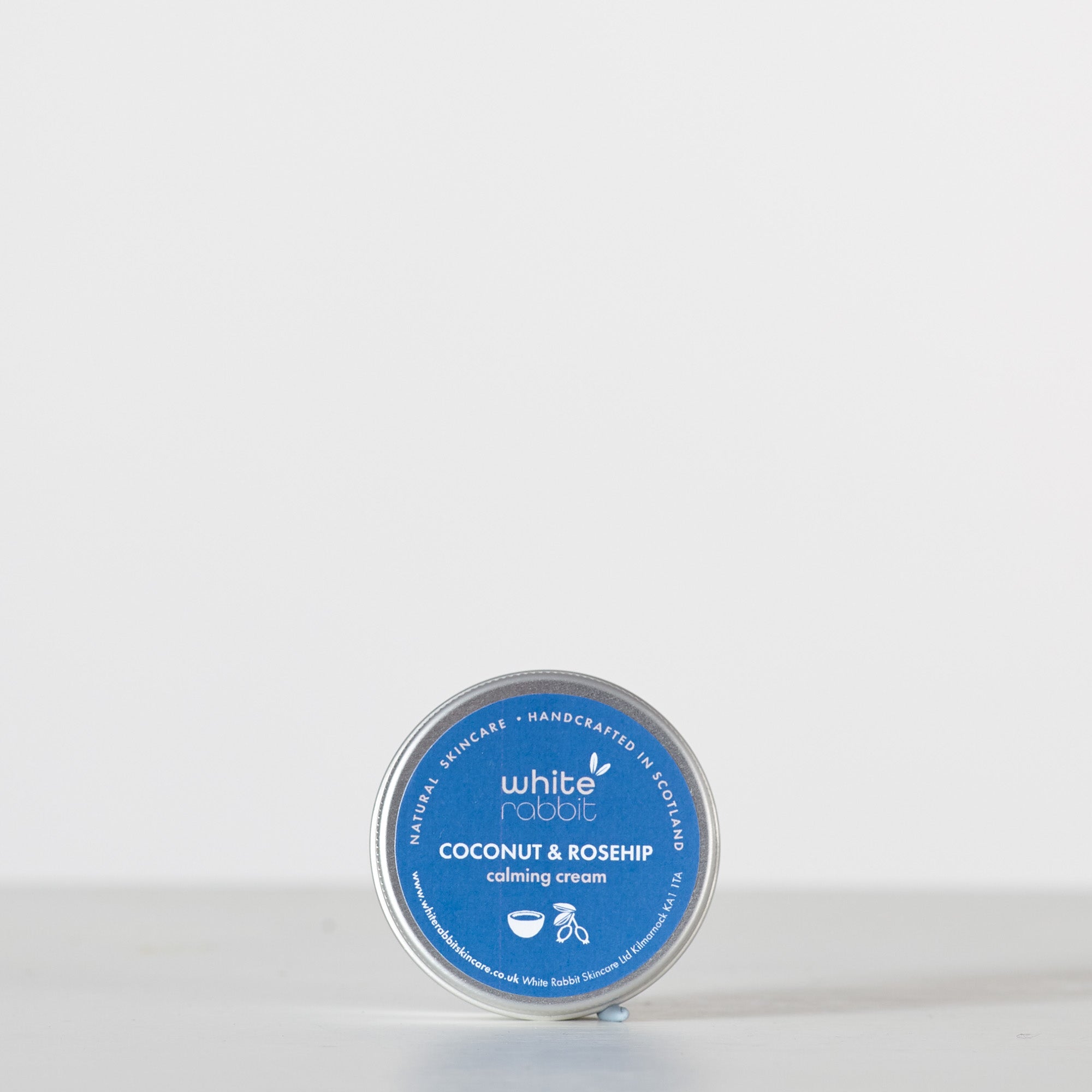 Tin of White Rabbit Coconut & Rosehip Calming Cream on a white background