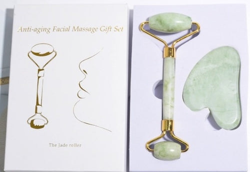 Anti-aging facial massage gift set with jade roller and gua sha tool on a white background