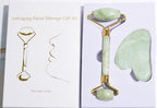 Anti-aging facial massage gift set with jade roller and gua sha tool on a white background