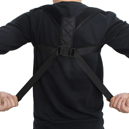 Person wearing a black back brace on a white background