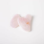 Heart-shaped pink objects on a white background