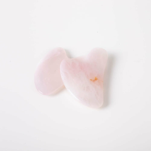 Heart-shaped pink objects on a white background