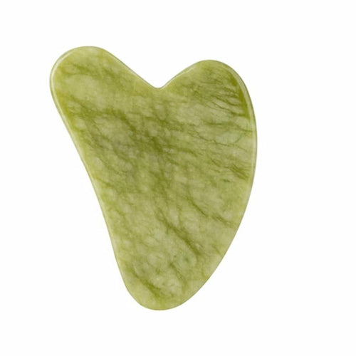 Green stone heart-shaped object on a white background