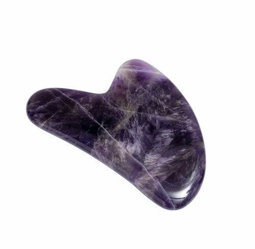 Purple stone tool on a white background