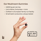 Hand holding a mushroom gummy with product details on a beige background